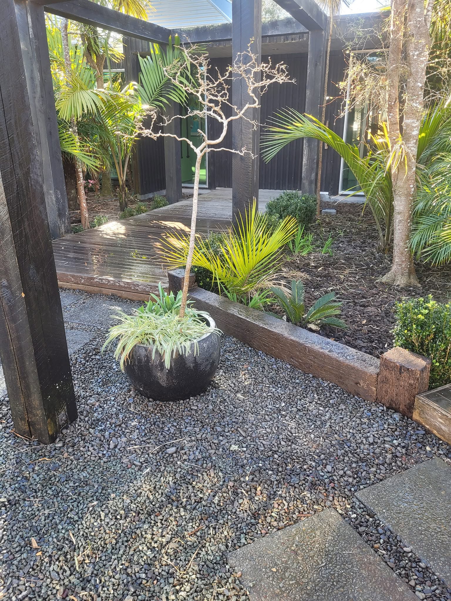 A simple and effective makeover using reclaimed railway sleepers to transform a small, untidy space into a neat and functional area. - After