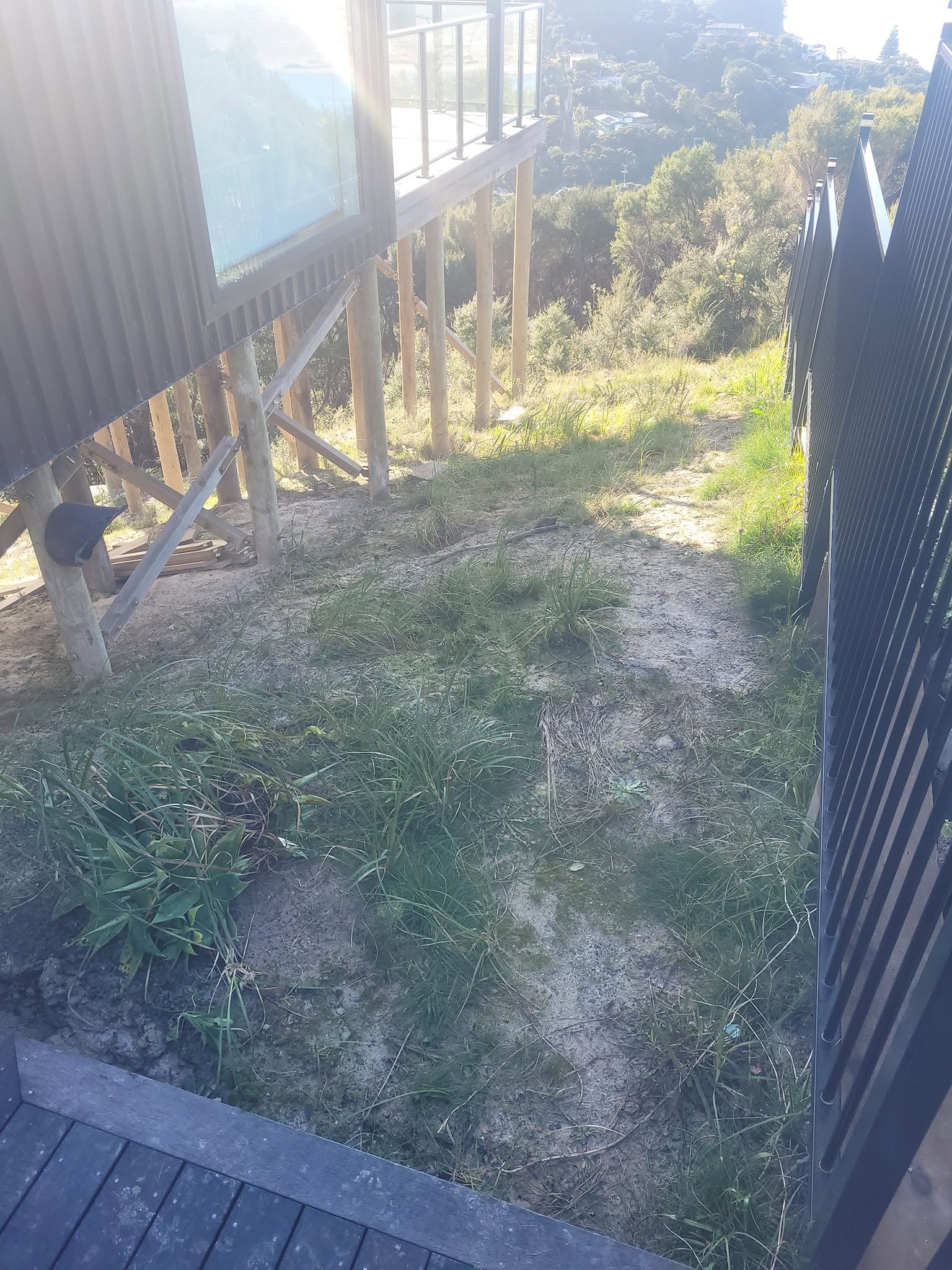 Our team built these custom hardwood stairs to provide safe, durable access to the new sleepout. Designed to suit the challenging site, they complement the home's style while creating a practical and attractive entrance. - Before